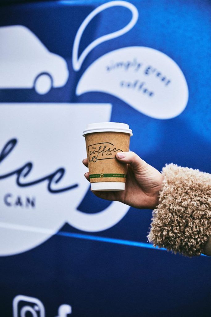 A coffee being held by our mobile coffee van