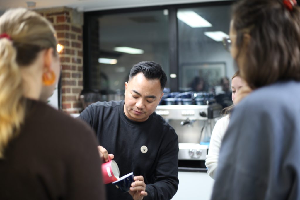 Dhan tamang pouring a latte