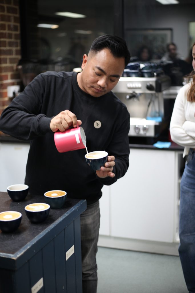 dhan tamang pouring a latte